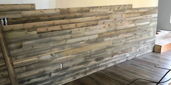 accent wall with dark weathered boards 