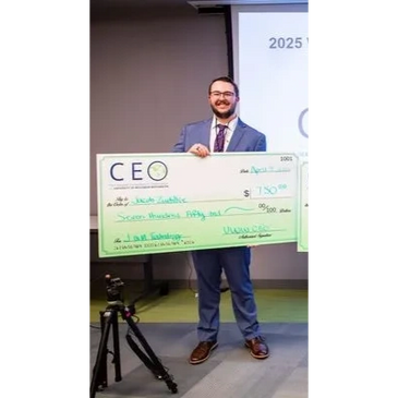J&M Technology Founder Smiling with big check after winning competition