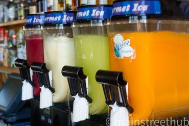 four fruit juices in containers