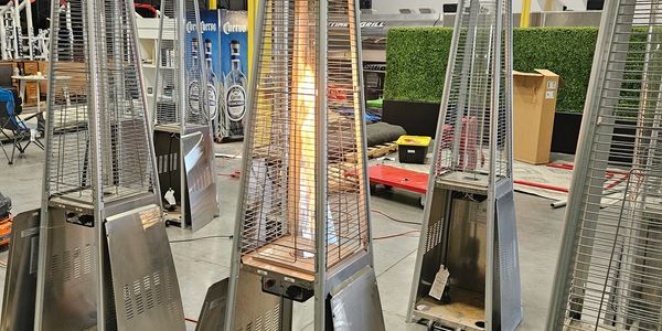 Outdoor patio heaters displayed indoors.