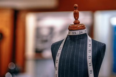 Measuring tape on a mannequin for sizing t shirts