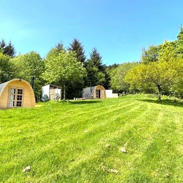glamping meadow with luxury glamping pods