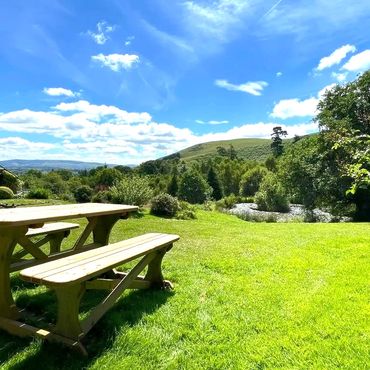 views over the valleys of mid wales. holiday accommodation with pond view