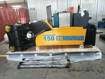 A yellow and black Soosan 150 SQ hydraulic breaker resting on a pallet indoors.