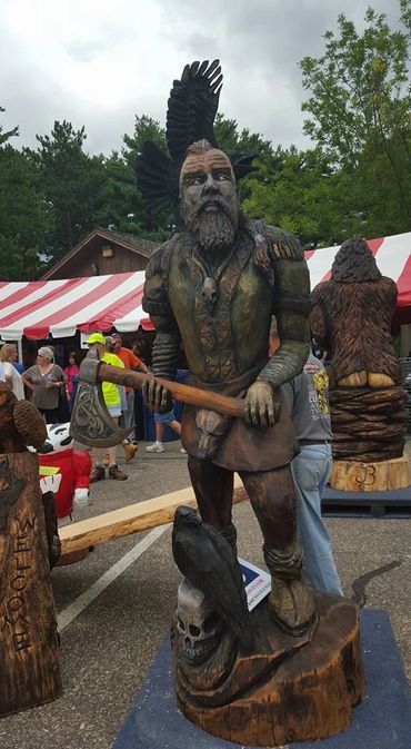 chainsaw competition carving of a viking warrior titled, "Call to Battle"