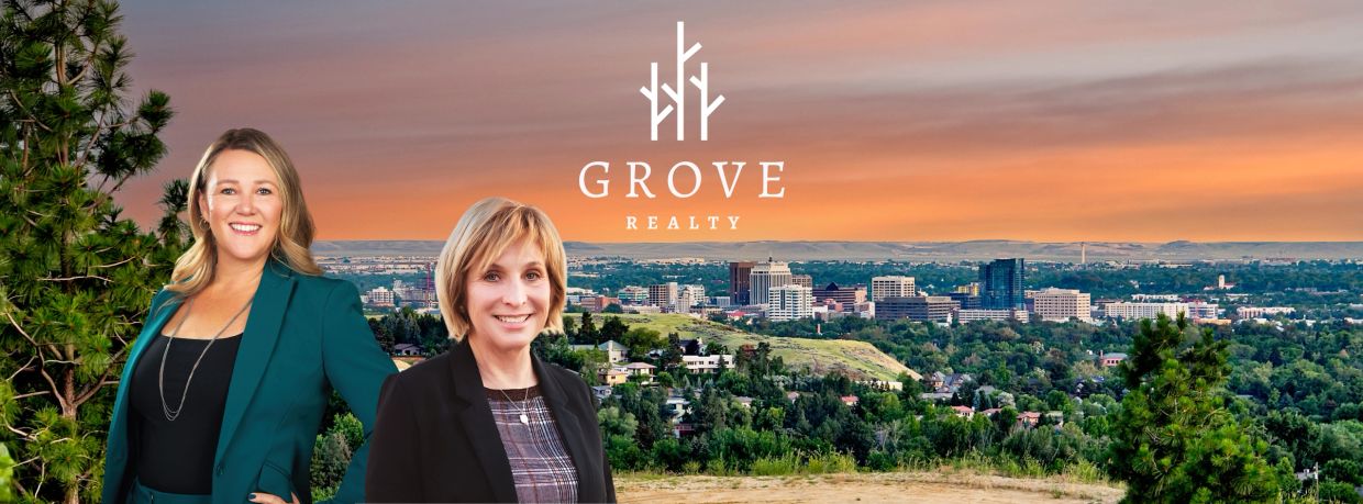 Two professional women with a cityscape and Grove Realty logo at sunset.