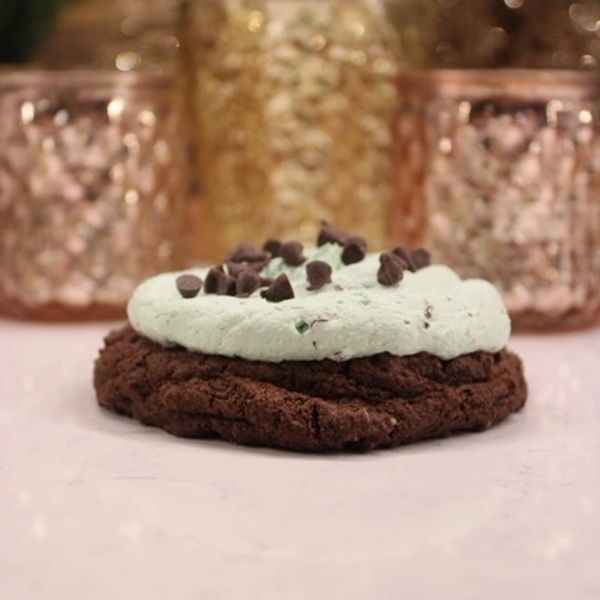 Chocolate cookie topped with mint cream and chocolate chips.