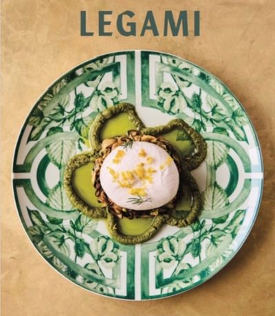 Elegant dish with a poached egg and green sauce on a patterned plate.