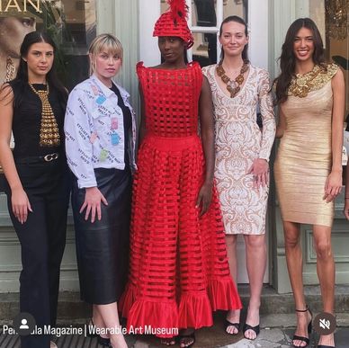 Five women showcasing diverse and artistic fashion styles in a group photo.