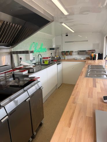 Clean and organized commercial kitchen space.