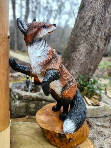 Fox chainsaw carving, carver Chris Gagnon 