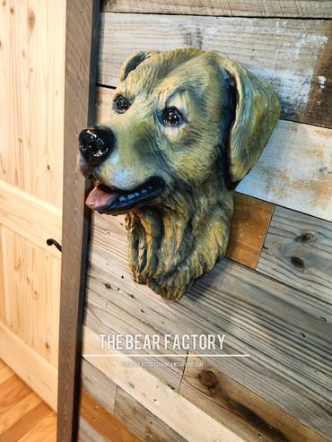 Dog chainsaw carving, carver Chris Gagnon 