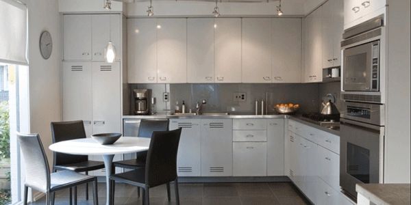 Kitchen renovation with track light, pendant lights, and recessed to give a modern look