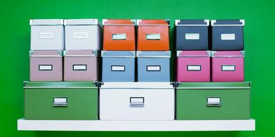 Organized boxes sitting on a shelf - handyman services