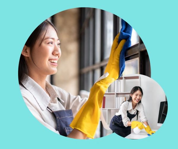 Woman cleaning windows and desk.