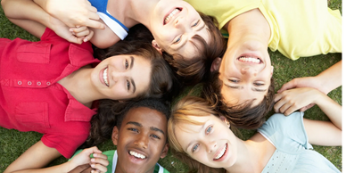 autistic tweens and teens in a circle at a camp to learn friendship skills