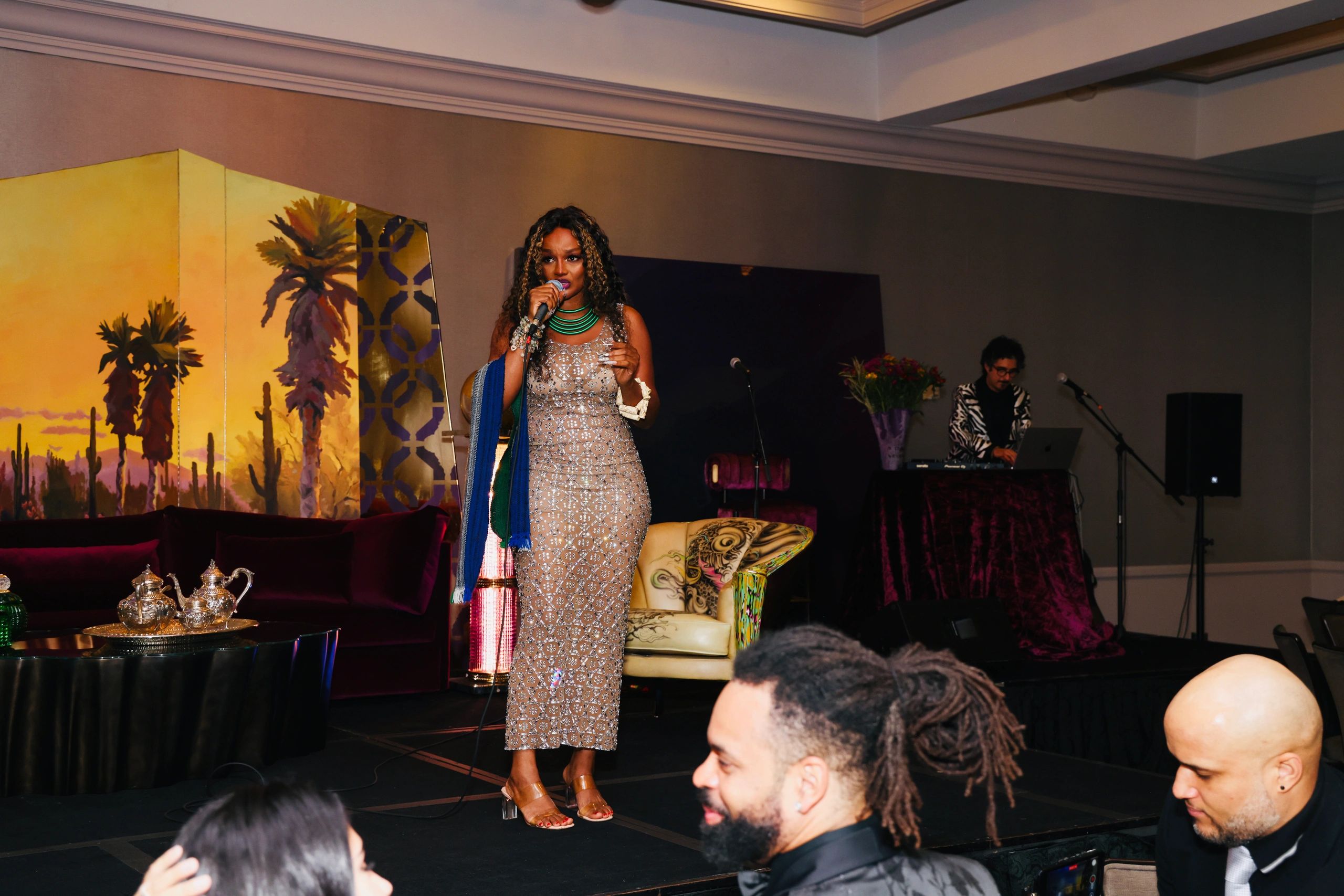 Queennak Foundation donating addressing the audience at the Beverly Hilton Hotel 