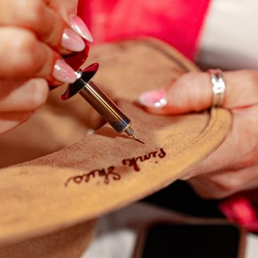 Hand written hat personalization.
