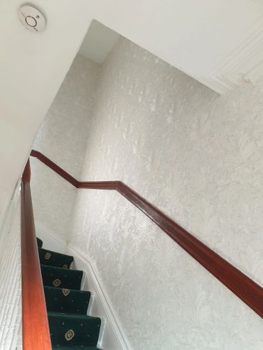 wall paper on the landing stairs and painted ceiling