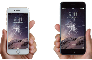 Two iPhones With Cracked Home Screens