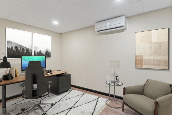 Modern minimalist home office with neutral tones and sleek furniture.