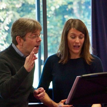 Eugene Asti coaching a student singing