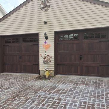 Carriage style garage door with mahogany accents