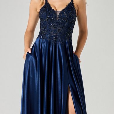 Elegant navy blue evening gown with lace bodice and thigh-high slit.
