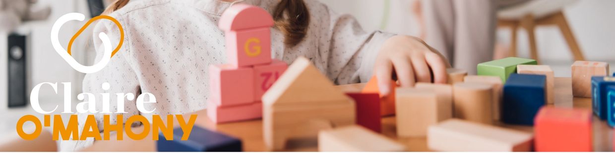 Child building with blocks in play therapy room