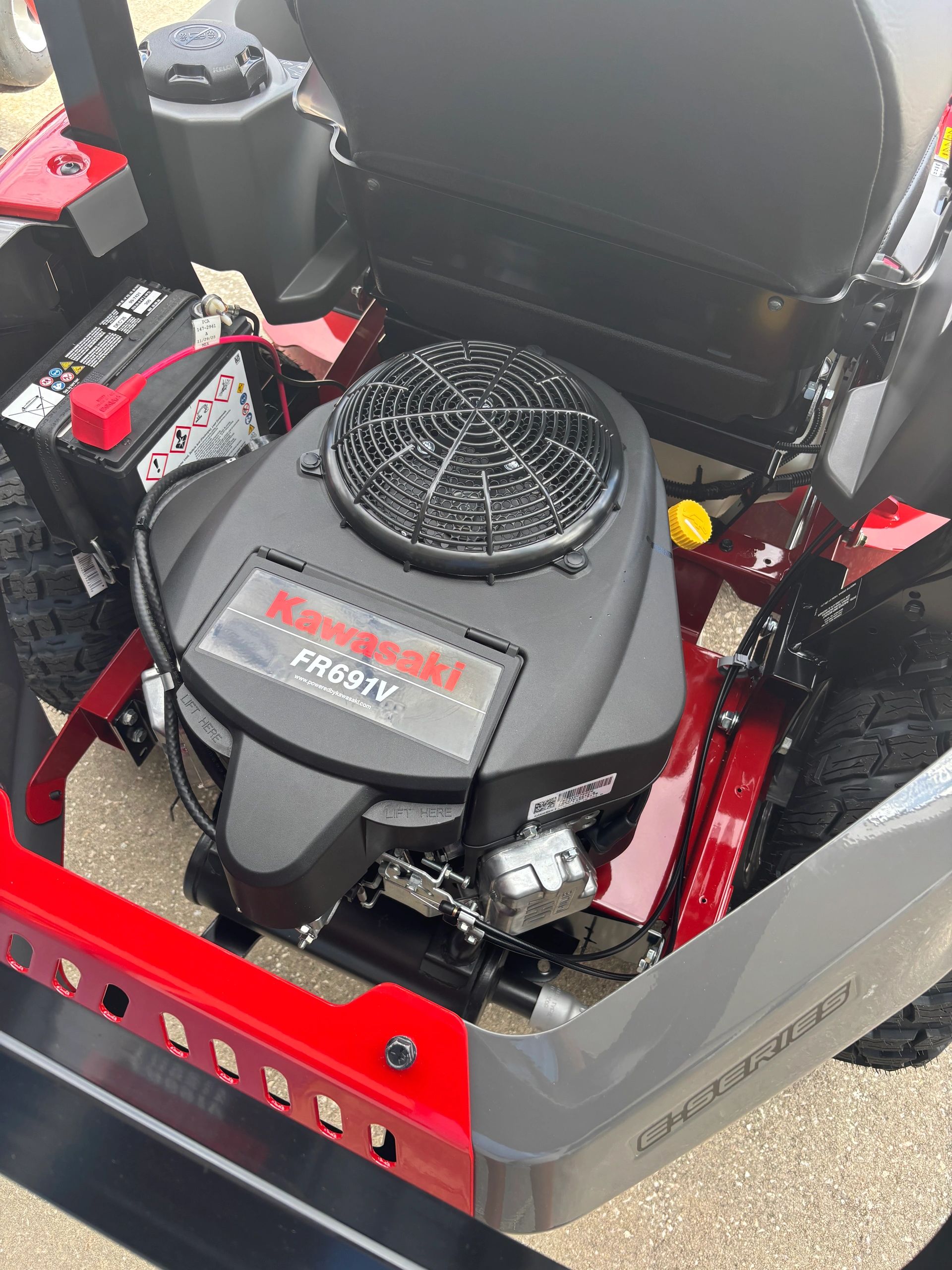 Close-up of a Kawasaki FR691V engine inside a red and gray E-Series vehicle.