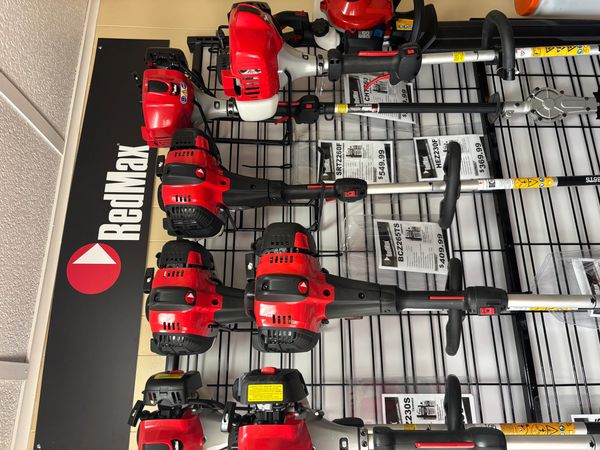 Display of RedMax branded outdoor power equipment.