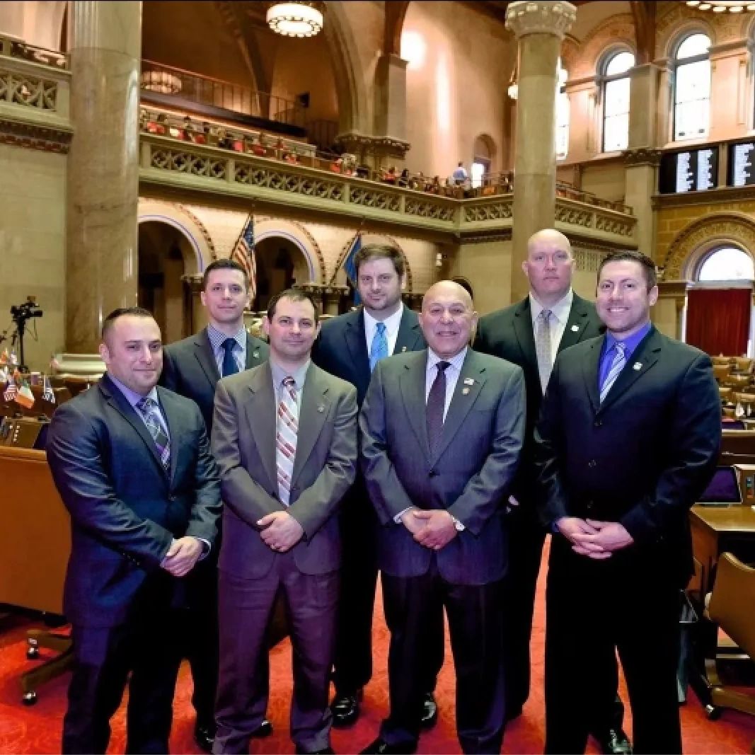 Members of the Niagara Falls Police Club meeting with members of the New York State Assembly.
