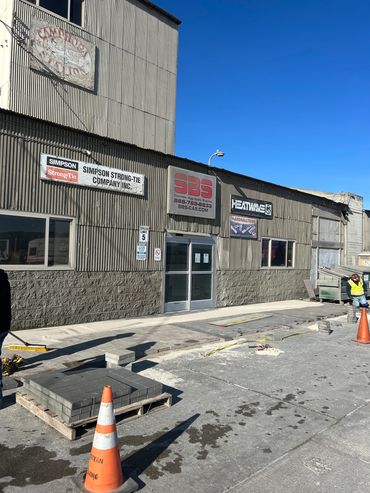 Employees installing pavers.