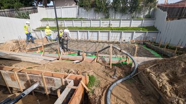 Men setting up concrete forms.
