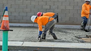 Men finishing concrete.