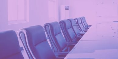 Empty conference room with chairs and table.