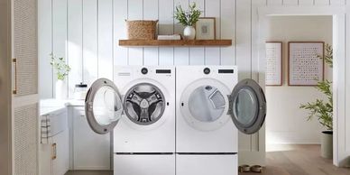Modern laundry room with front-loading washer and dryer in a bright, clean space.