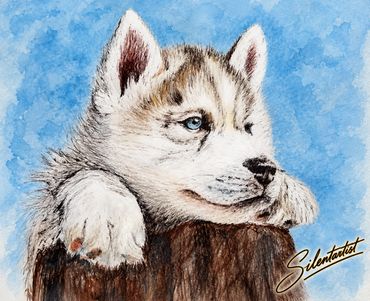 Image description:
Blue-eyed husky puppy resting its paws on a tree stump.