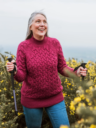 Confident woman smiling on a Colorado mountain after self-esteem counseling