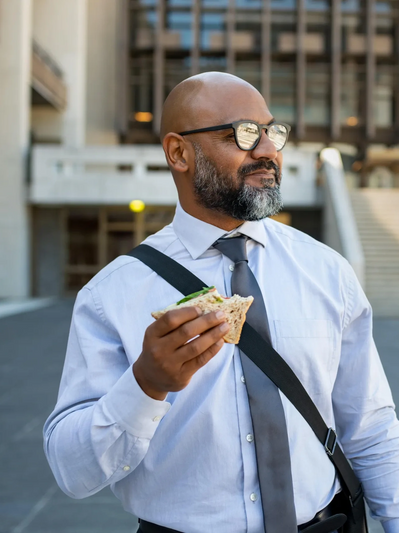 Man eating lunch in Ohio, showing balance, confidence, and relief through online anxiety therapy.

