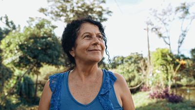 Older woman smiling outdoors, showing hope and healing after grief and loss counseling in Arizona