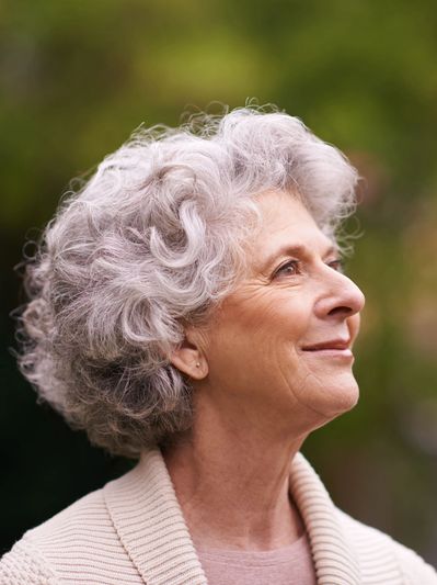 Smiling  woman feeling relief after anxiety and counseling session.


