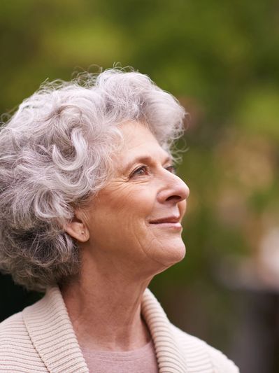 Smiling  woman feeling relief after anxiety and counseling session.

