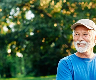 Smiling man standing outdoors, showing confidence, peace, and healing through depression counseling.