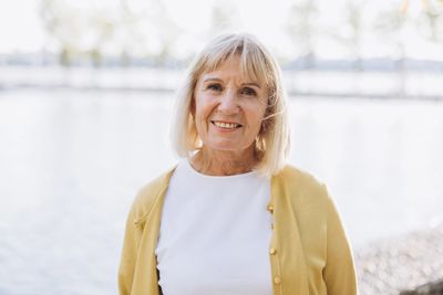 Colorado woman smiling outdoors, representing hope and healing after grief and loss counseling 