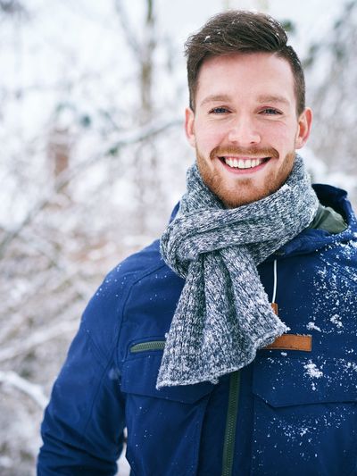 A smiling young man in Colorado feels relieved after an anxiety and depression counseling session.

