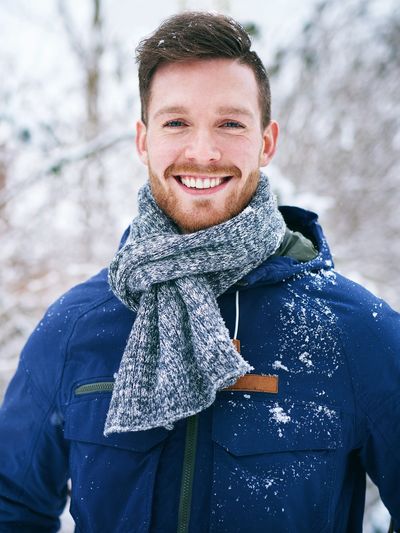 A smiling young man in Colorado feels relieved after an anxiety and depression counseling session.

