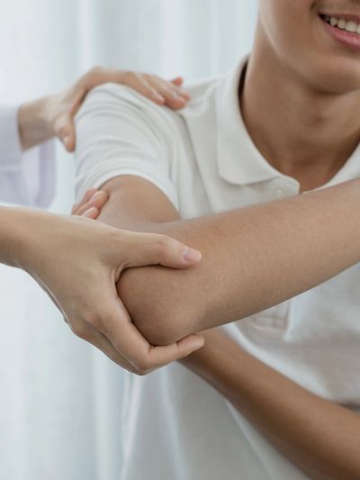 Physiotherapist treating a patient