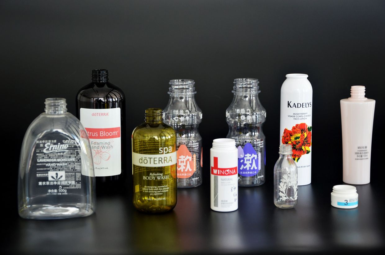 Various plastic and glass cosmetic bottles printed with high-adhesion screen printing ink
