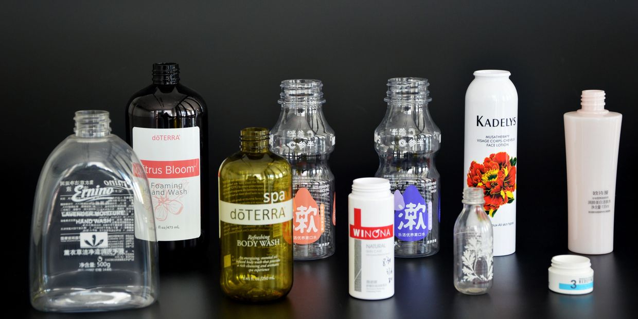 Various plastic and glass cosmetic bottles printed with high-adhesion screen printing ink